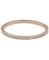 Style meant for stacking. This must-have design by Michael Kors combines a thin, stackable bangle with pave-set glass accents. Set in rose gold tone mixed metal. Approximate diameter: 2-1/2 inches.