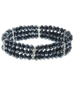 In the navy. Beautiful beads in a dramatic dark blue hue lend an elegant effect to 2028's stretch bracelet. Also adorned with sparkling crystals, it's made in silver tone mixed metal. The stretch design makes it easy and comfortable to wear. Approximate length: 7 inches.