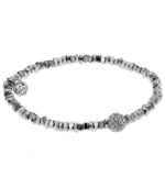 This season's most on-trend accessories are the ones perfect for stacking. Michael Kors' sleek, stretchable style combines silver beading with a pave crystal fireball for ultimate shimmer and shine. Crafted in silver tone mixed metal. Approximate diameter: 2/1/4 inches. Approximate width: 1/8 inch.