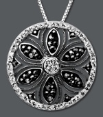 Spring is in full bloom. Kaleidoscope's unique flower pendant is adorned with black crystals made from Swarovski Elements. Set in sterling silver. Approximate length: 18 inches. Approximate drop: 2-8/10 inches.