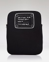 The writing is on this neoprene MARC BY MARC JACOBS case, which is designed to cleverly conceal (and protect) your iPad.