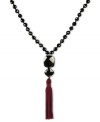 Dramatically chic. This pretty v-shaped necklace highlights black onyx beads (198 ct. t.w.) and a trendy tassel accent in burgundy. Set in sterling silver. Approximate length: 28 inches. Approximate drop: 4-1/2 inches.