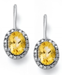 True glamour. Victoria Townsend's beautiful leverback earrings feature oval-cut citrine (2-1/2 ct. t.w.) and sparkling diamond accents. Set in sterling silver. Approximate drop: 3/4 inch.