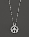 From the Tiny Treasures collection, a diamond peace sign necklace; with signature ruby accent. Designed by Roberto Coin.