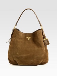 Classic suede hobo design with front goldtone logo.Shoulder strap, 7½ dropMagnetic snap closureProtective metal feetOne inside zip pocketThree inside open pocketsSignature jacquard lining15½W X 13½H X 4¼DMade in Italy