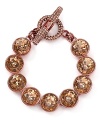 Love heavy metal? Rock out with this striking Juicy Couture bracelet, which features an all around of rose gold stones.