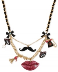 Face value. Betsey Johnson features features in this gold-tone mixed-metal frontal necklace. Glittery glass accents will make everyone want to see your face. Approximate length: 16 inches + 3-inch extender. Approximate drop: 2-1/4 inches.