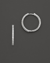 Inside/outside diamond hoop earrings; with signature ruby accent. Post closure for pierced ears. Designed by Roberto Coin.