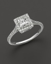 Princess-cut diamond ring with diamond band.