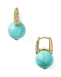 Take your lobes on a tropical vacation and opt for MICHAEL Michael Kors' turquoise earrings. The bright baubles punch up neutral palettes and all-black with island-inspired color.