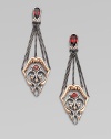 From the Les Dents de la Mer Collection. A golden shark jaw, jagged teeth and all, becomes a delightful design element in these graceful filigree earrings that hang from garnet teardrops and blackened chains.Red garnetRose goldplated sterling silver and black rhodium-plated sterling silverLength, about 2¾14k gold post backImported