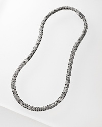 Signature woven chain necklace with hammered disc pendant and a carved chain clasp, designed by John Hardy.