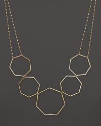 A modern statement necklace in yellow gold from Lana.