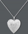 Whatever your heart desires. This intricate pendant offers a stunning engraved surface, sparkling diamond accent and charming locket design. Set in sterling silver. Approximate length: 18 inches. Approximate drop: 1-1/4 inches.