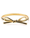 Take a bow. This delicate bangle wraps the wrist in kate spade new york style.