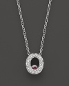 From the Tiny Treasures collection, a diamond O necklace. With signature ruby accent. Designed by Roberto Coin.