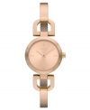 Fashioned with a unique bangle bracelet, this rosy DKNY watch is an everyday charmer.