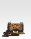 Beautiful leopard print hair calf with supple leather trim, perfect for all your essentials.Detachable leather and chain shoulder strap, 23½ dropTurnlock flap closureDetachable tassel accentOne outside open pocketOne inside zip pocketFully lined6¾W X 5H X 1½DImported