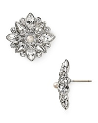 Radiance becomes you: Carolee Lux crafts a forever-feminine statement with these floral-shaped button earrings.