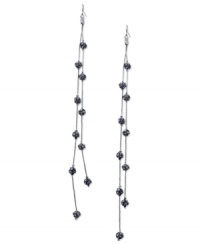 Fire up your evening with these two-row linear earrings from GUESS. Black diamond-embellished fireballs hang from metal chains. Crafted in hematite tone mixed metal. Approximate drop: 7 inches.