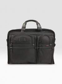 A slim, organized brief case for large screen laptops (up to 17). Separate cushioned laptop compartment Removable accessory pouch Interior pockets and elastic organizer panel Carry handles and removable, adjustable shoulder strap Add-a-bag sleeve for attaching to other cases Tumi Tracer Protection Ballistic nylon 13½H X 17½W X 3½D Imported