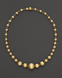 Gorgeously textured beads of 18K yellow gold gleam richly on this necklace from the Africa Collection.