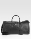 Textured saffiano leather duffel with tessuto nylon lining.Double top handlesAdjustable shoulder strapsZip closureFully lined21W x 10¼H x 9DMade in Italy