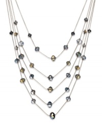 Find a sophisticated new level of style. This five-row illusion necklace by c.A.K.e by Ali Khan boasts opal-colored glass beads (10-12 mm). Set in gold tone mixed metal. Approximate length: 17 inches + 3-inch extender. Approximate drop: 6 inches.