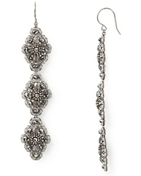 Dangling drop earrings from Miguel Ases blend textured beading with pearlescent luminance for dramatic earth goddess glamour.