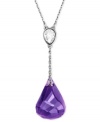 Amazing amethyst. Purple reigns in this pendant from Swarovski. Crafted from rhodium-plated mixed metal and featuring a stunning amethyst offset with crystal accents, this necklace is a thing of beauty.  Approximate length: 16 inches. Approximate drop: 1 inch.