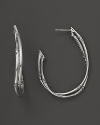 A pair of bamboo hoop earrings from John Hardy make a timeless statement in sterling silver.