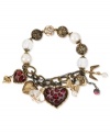 Quite charming. Betsey Johnson's half stretch charm bracelet, is crafted from gold- and hematite-tone mixed metal with glass pearls and glistening accents for a whimsical touch. Item comes packaged in a signature Betsey Johnson Gift Box. Approximate length: 7-1/2 inches.