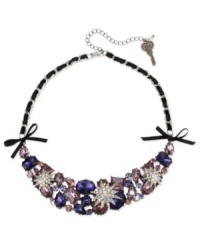 A burst of beauty. This frontal necklace from Betsey Johnson is crafted from hematite-tone mixed metal and black grosgrain ribbon. Colorful glass crystal accents provide a glistening touch. Approximate length: 15 inches + 3-inch extender. Approximate drop: 1-1/5 inches.