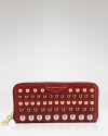 This MARC BY MARC JACOBS wallet is equal parts smarts and sass. Its exterior is detailed with bold studs, while its lined interior is organized for the essentials.