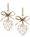 Glittering and girly. Add fun, flirty flair to your look with Betsey Johnson's heart-shaped drop earrings. Embellished with sparkling crystal accents and charming bows, they're made in gold tone mixed metal. Approximate drop: 1-3/4 inches.