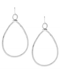 Let your style roam. Kenneth Cole New York's hammered hoop earrings add a classic teardrop touch to any look. Set in silver tone mixed metal. Approximate drop: 2-3/4 inches. Approximate width: 1-1/2 inches.