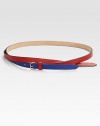 A graphic, colorblocked style with a cross-over design and a brass buckle. Width, about ½Made in Italy