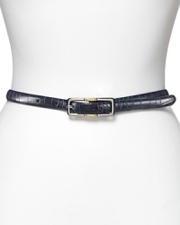 Lauren Ralph Lauren's belt in halting red is in croco-embossed leather and reverses to a smooth black leather for modern versatility. Crafted with a two-tone reversible, rectangular buckle that rotates from silver to gold-tone on a single screw.