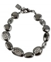 An elegant addition. This bracelet from Robert Lee Morris, crafted from hematite-tone mixed metal, dazzles with glass pave crystal accents adding a lustrous touch. Approximate length: 7-1/2 inches.