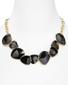 Geometric discs are a bold focal point on this Kenneth Jay Lane necklace, with a simple gold chain as the compliment.