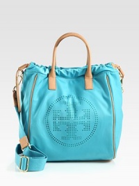 A bright and lightweight design with a perforated logo emblem accented in luxurious leather.Double leather top handles, 4 dropDetachable adjustable shoulder strap, 15-25½ dropMagnetic snap closure with drawstringOne outside open pocketOne inside zip pocketTwo inside open pocketsCotton lining11½W X 14½H X 7DImported