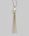 A striking white baroque pearl is the centerpiece of this delightful design, accented with a tassel of delicate gold chains. 16mm baroque, organic, man-made white pearl 18k gold vermeil Length, about 36 Made in Spain