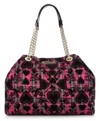 Bold, bright and unquestionably eye-catching, this take-anywhere tote from Betsey Johnson adds interest to everyday accessorizing. Golden chain-link straps and signature hadrware play up the pretty pattern, while the spacious interior holds all your daily essentials without a worry.