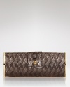 Rich snake-embossed leather lends natural elegance to this Tory Burch clutch, styled in a palm-perfect shape.