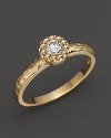 Faceted diamond set in a textured 14K. yellow gold band.