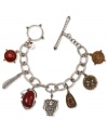 The charmed life. Lucky Brand offers this charm bracelet crafted from silver and gold tone mixed metal featuring a finely detailed owl surrounded by picture jasper and semi-precious calcite and carnelian accents. Approximate length: 7-3/4 inches.