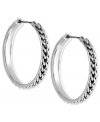 Understated elegance. Nine West offers a pair of hoop earrings crafted from textured silver tone mixed metal to go with anything for a night out. Approximate drop: 1-1/4 inches. Approximate diameter: 1-1/4 inches.