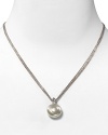 Centered on a beautiful coin pearl, this pendant necklace features a triple stainless steel chain. Designed by Majorica.