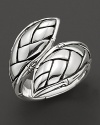 A bamboo leaf, delicately rendered in sterling silver, dramatically circles your finger.