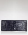 This Elie Tahari clutch brings a textured touch to your evening portfolio with rich, croc-embossed leather, styled to show a hint of skin after dark.